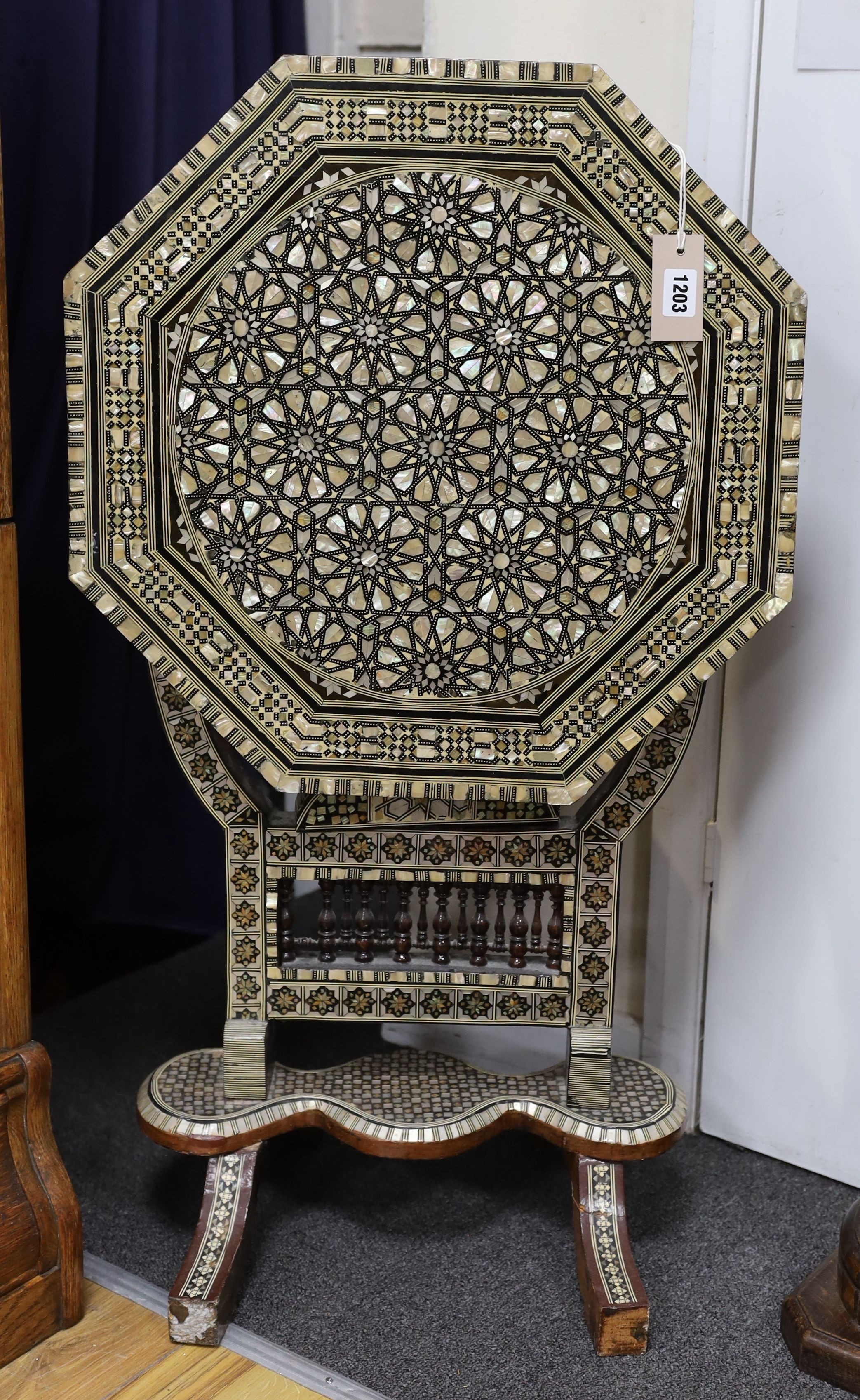 A Damascusware and mother of pearl inlaid octagonal tilt top table, width 50cm, height 66cm